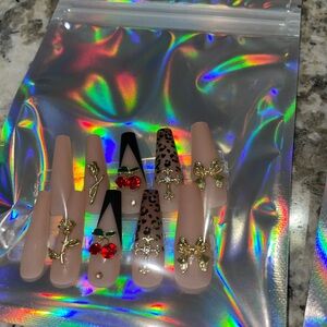 Stylish Nail Art Set with Gold and Red Accents